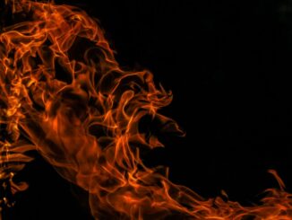 Abstract image of swirling orange flames against a dark background, creating a dynamic and intense visual effect. The image represents the name of the product reviewed in the article: ThermoPro Burn Ultra Review.